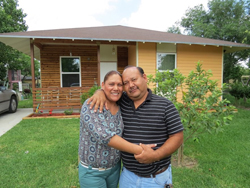 Residents in front of their house